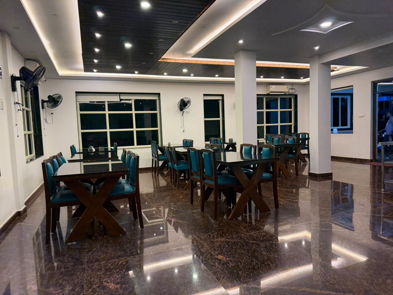 The restaurant seating area with windows onto the garden